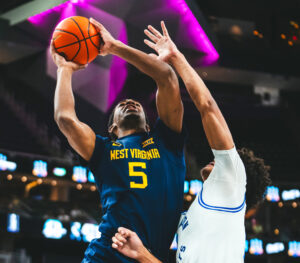 D.J. Thomas leads WVU past Creighton and into the finals of the College Basketball Crown